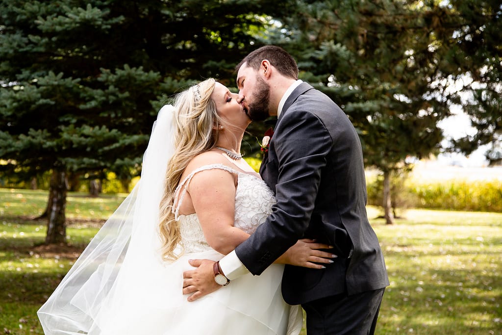 couple kissing Elm Hurst wedding photography by london ontario photographer Woodgate Photography