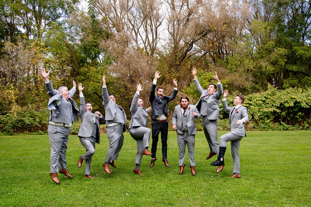 groomsmen jumping Elm Hurst wedding photography by london ontario photographer Woodgate Photography