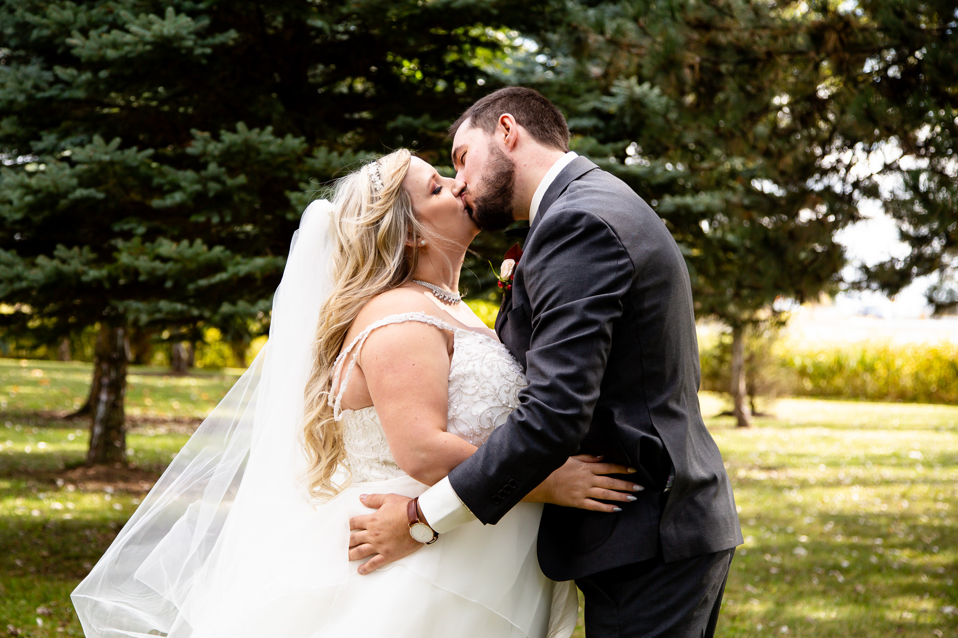couple kissing Elm Hurst wedding photography by london ontario photographer Woodgate Photography