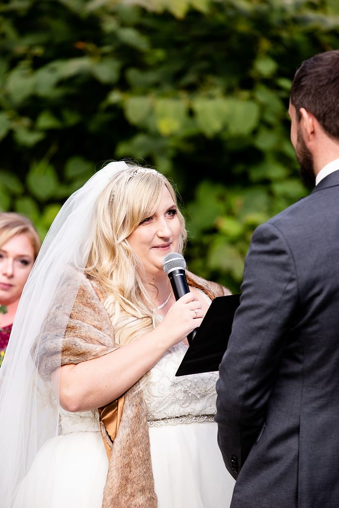 bride saying vows Elm Hurst wedding photography by london ontario photographer Woodgate Photography